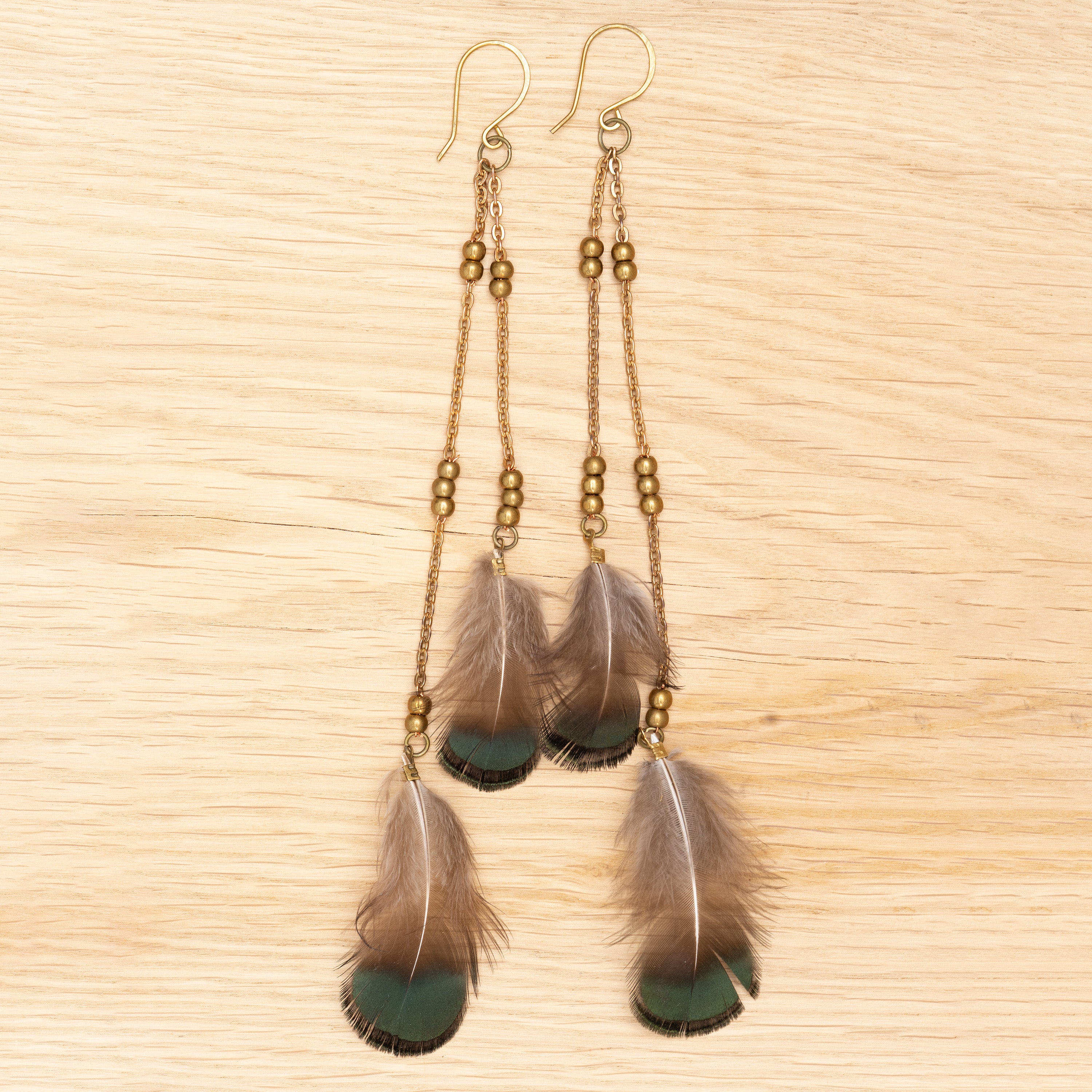 Flowing Feather Earrings in Bronze